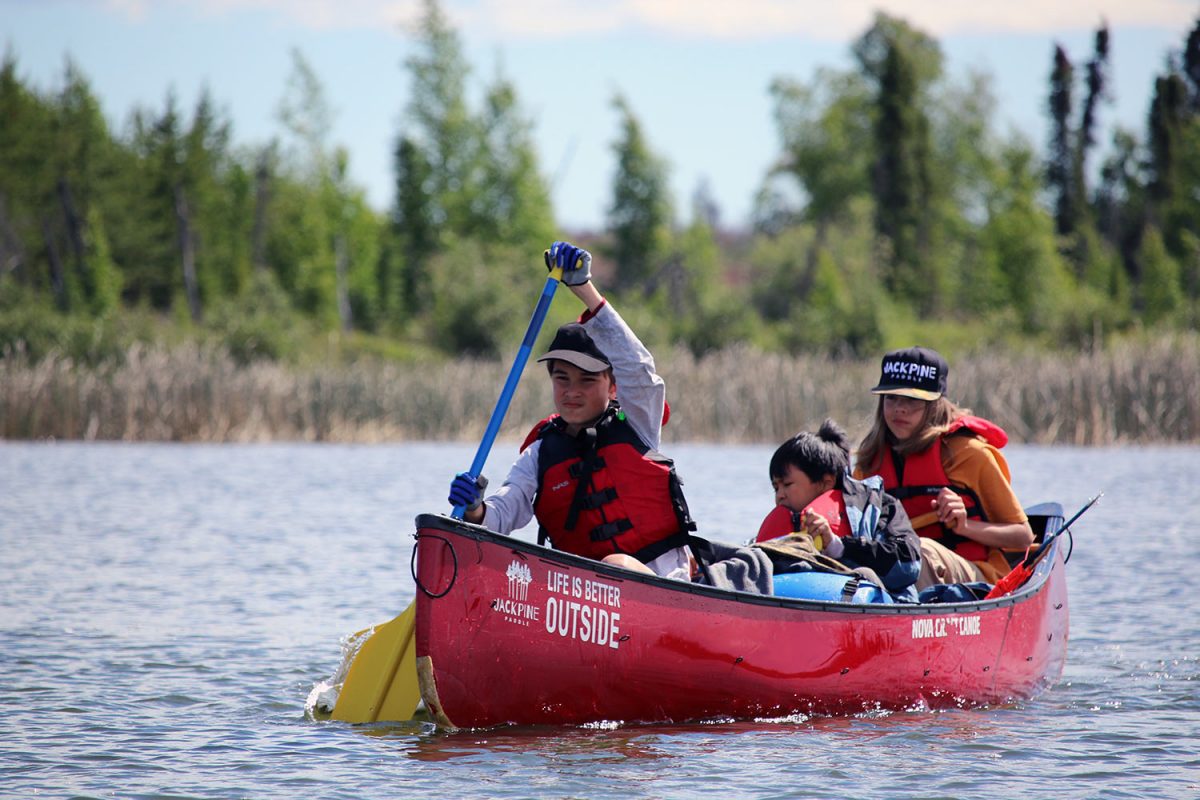 canoe and kayaks on a lake