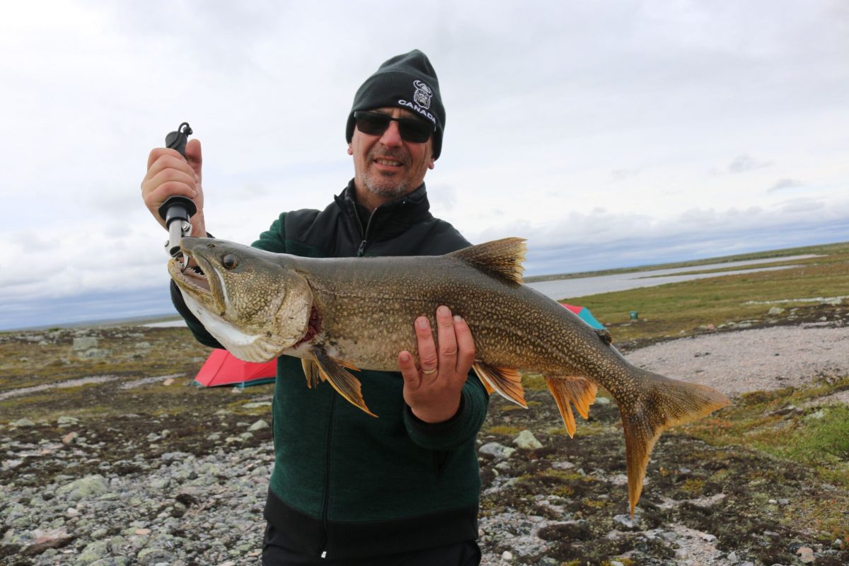 man holding large lake trout
