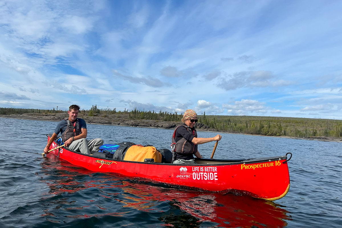 2 people taking a canoe course in canada