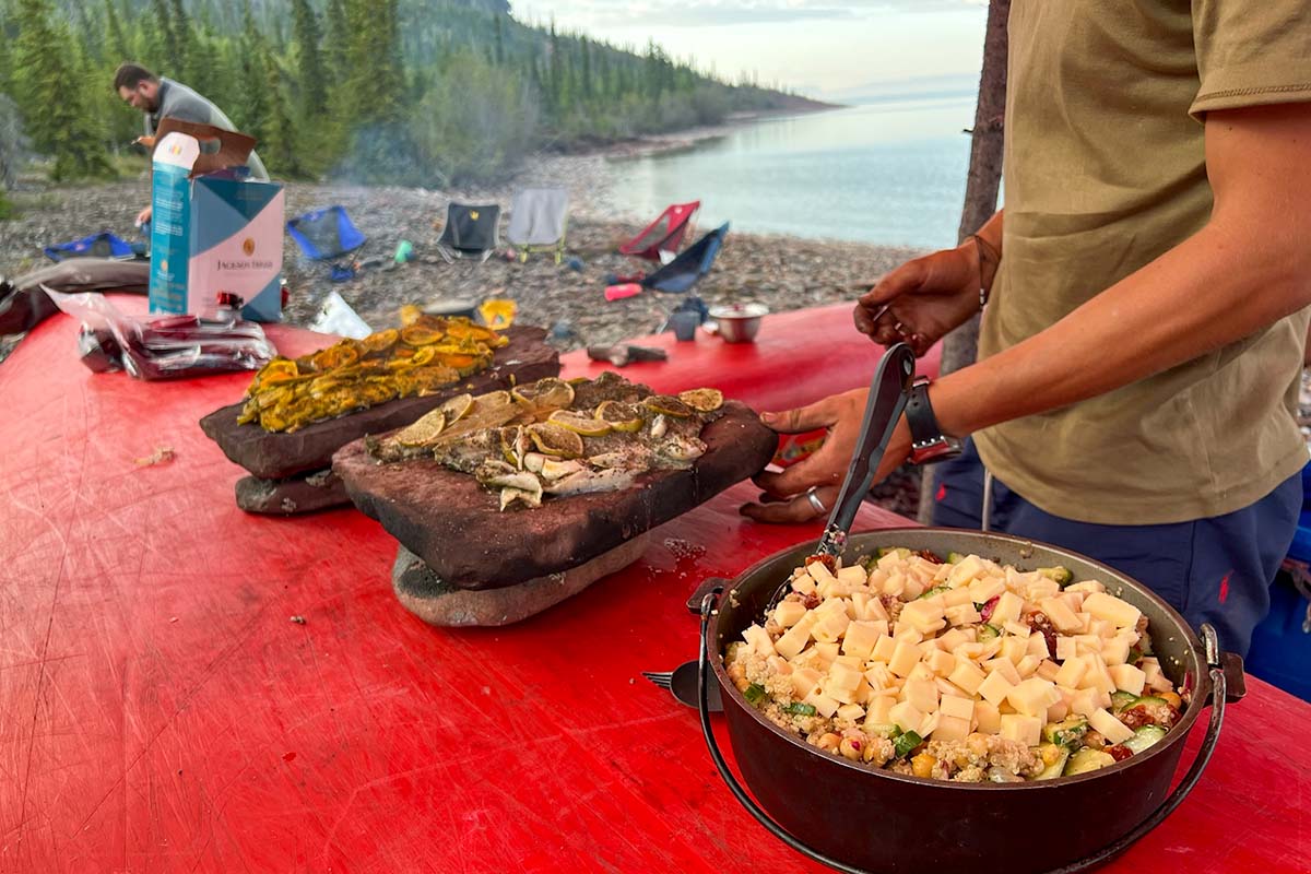 learning to cook while on a canoe trip